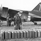 A US Army nurse helps unload jerry cans of gasoline from a C-47 near Reims, France in 1944. (US Army)